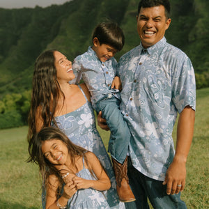 man wearing blue paisley printed aloha button up shirt