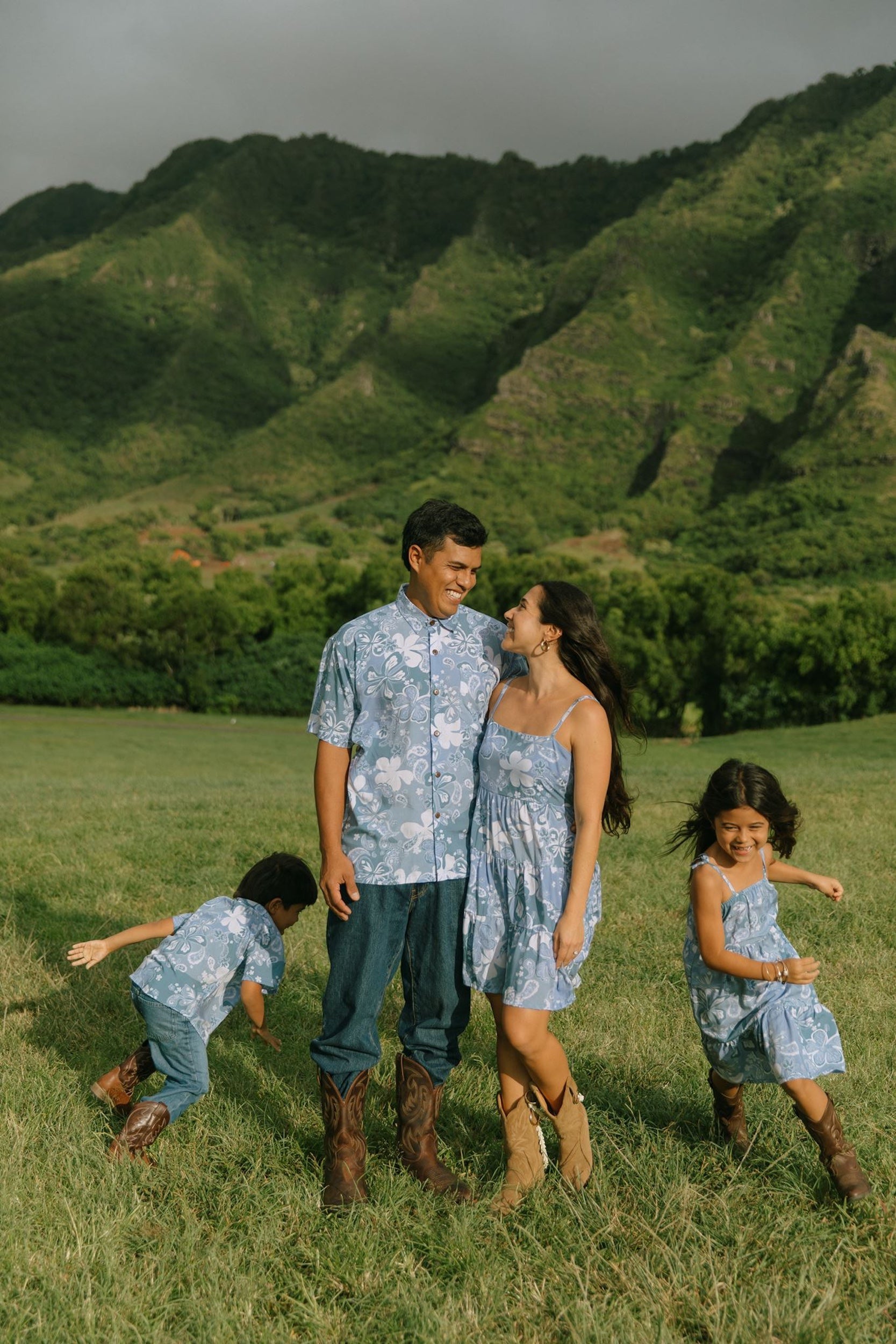 man wearing blue paisley printed aloha button up shirt