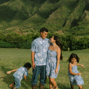 man wearing blue paisley printed aloha button up shirt