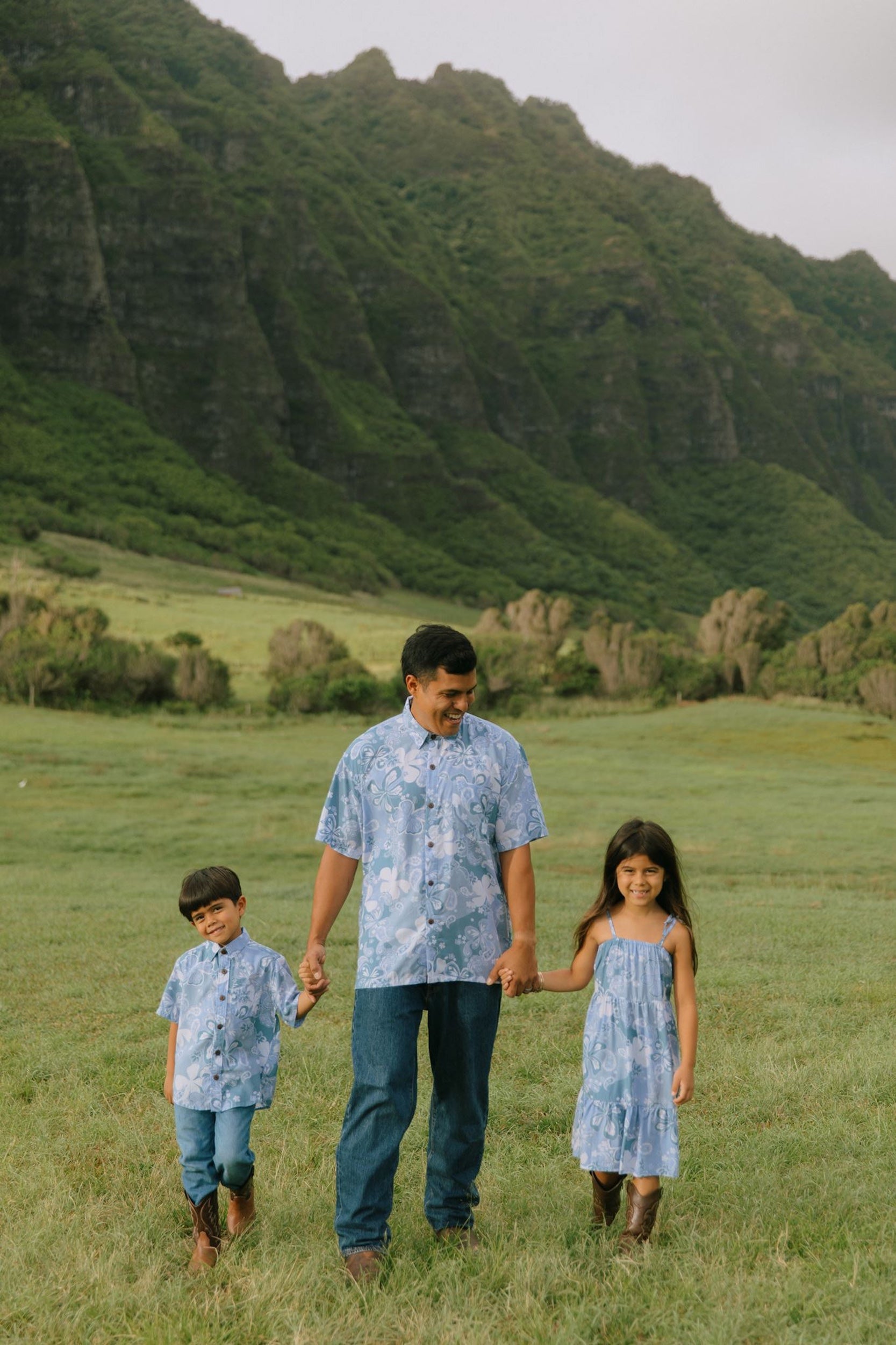 man wearing blue paisley printed aloha button up shirt