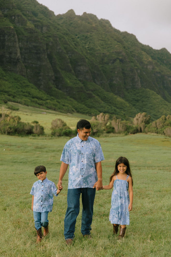 man wearing blue paisley printed aloha button up shirt