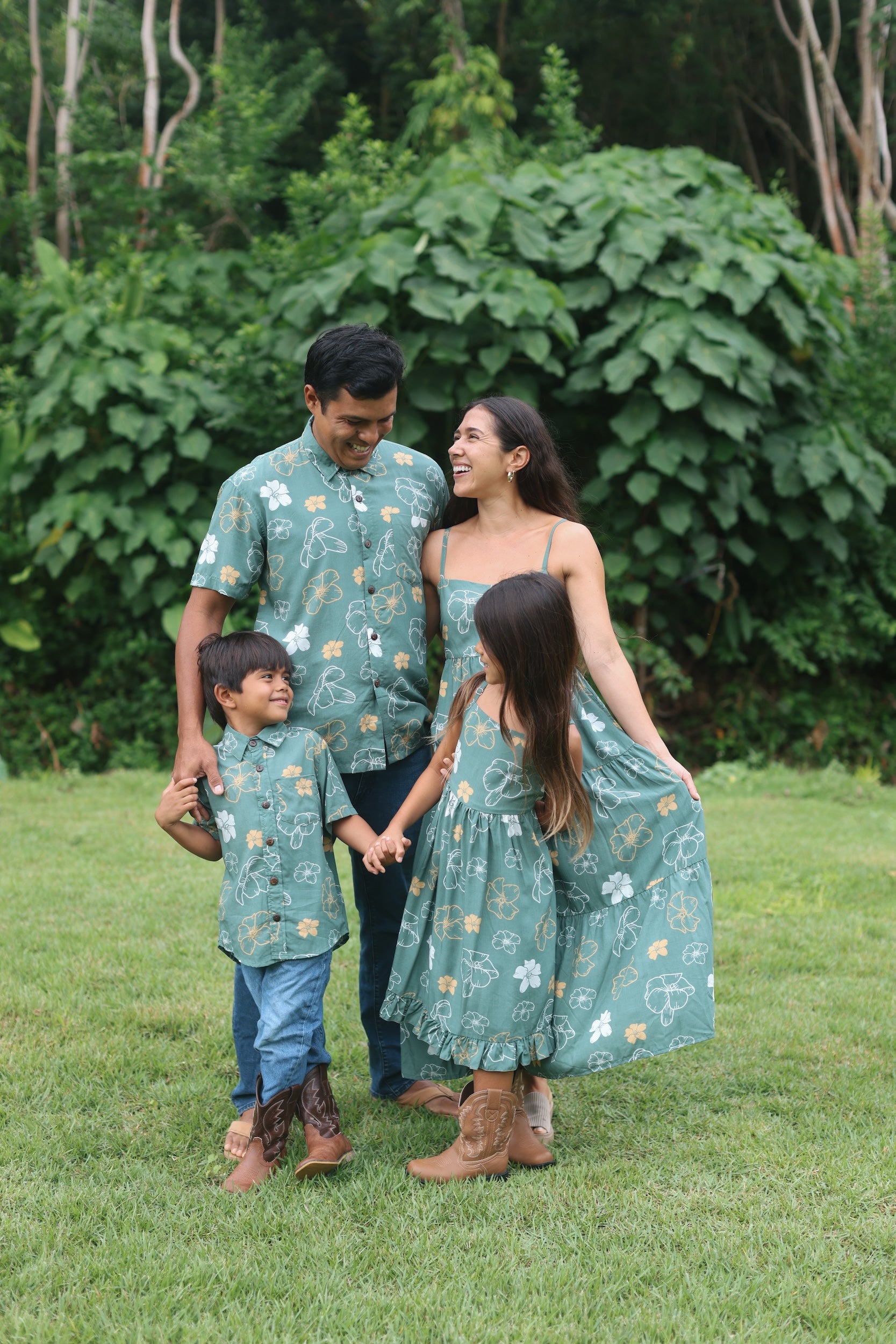 man wearing lush green aloha button-up shirt with pua kenikeni print