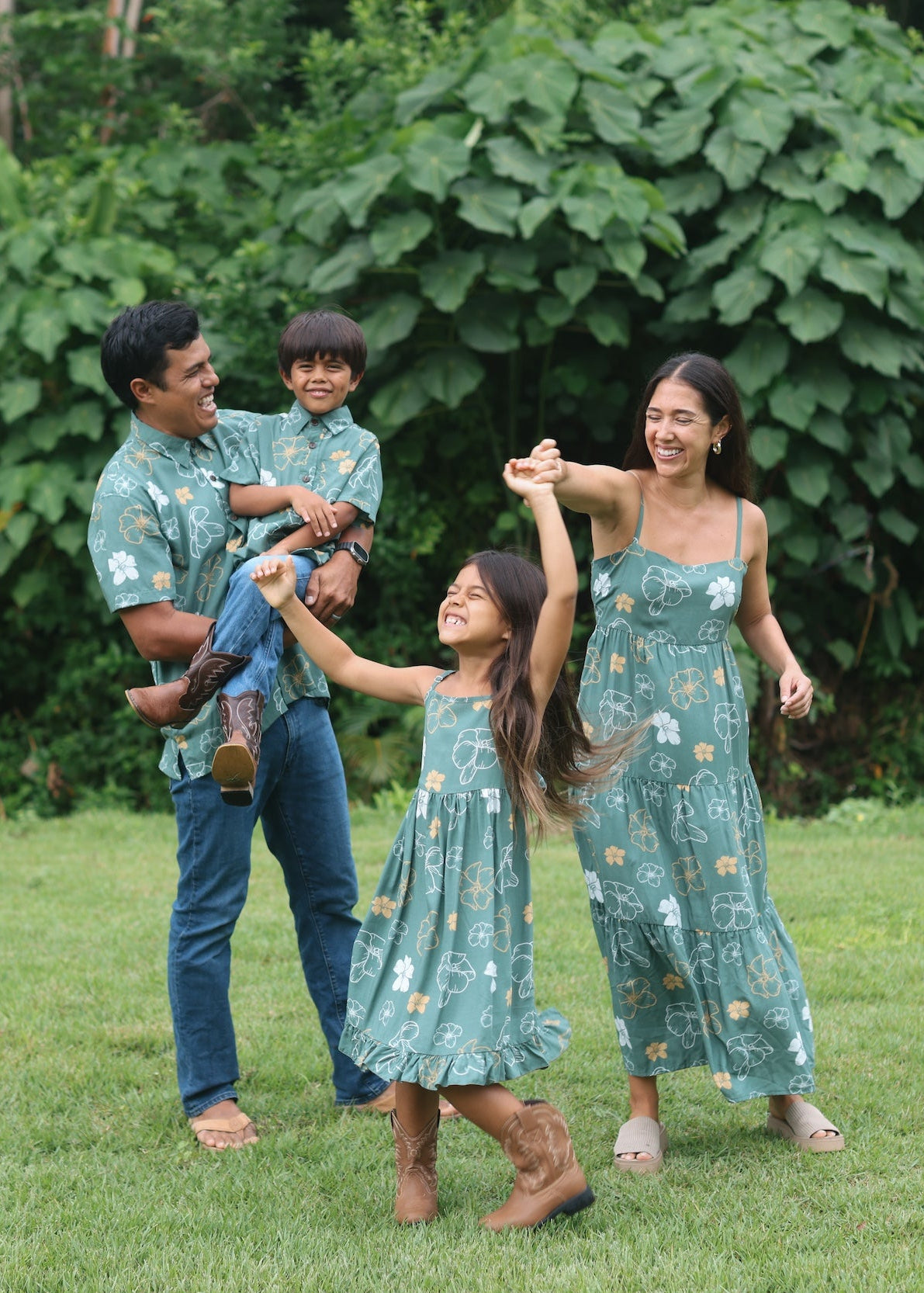 man wearing lush green aloha button-up shirt with pua kenikeni print