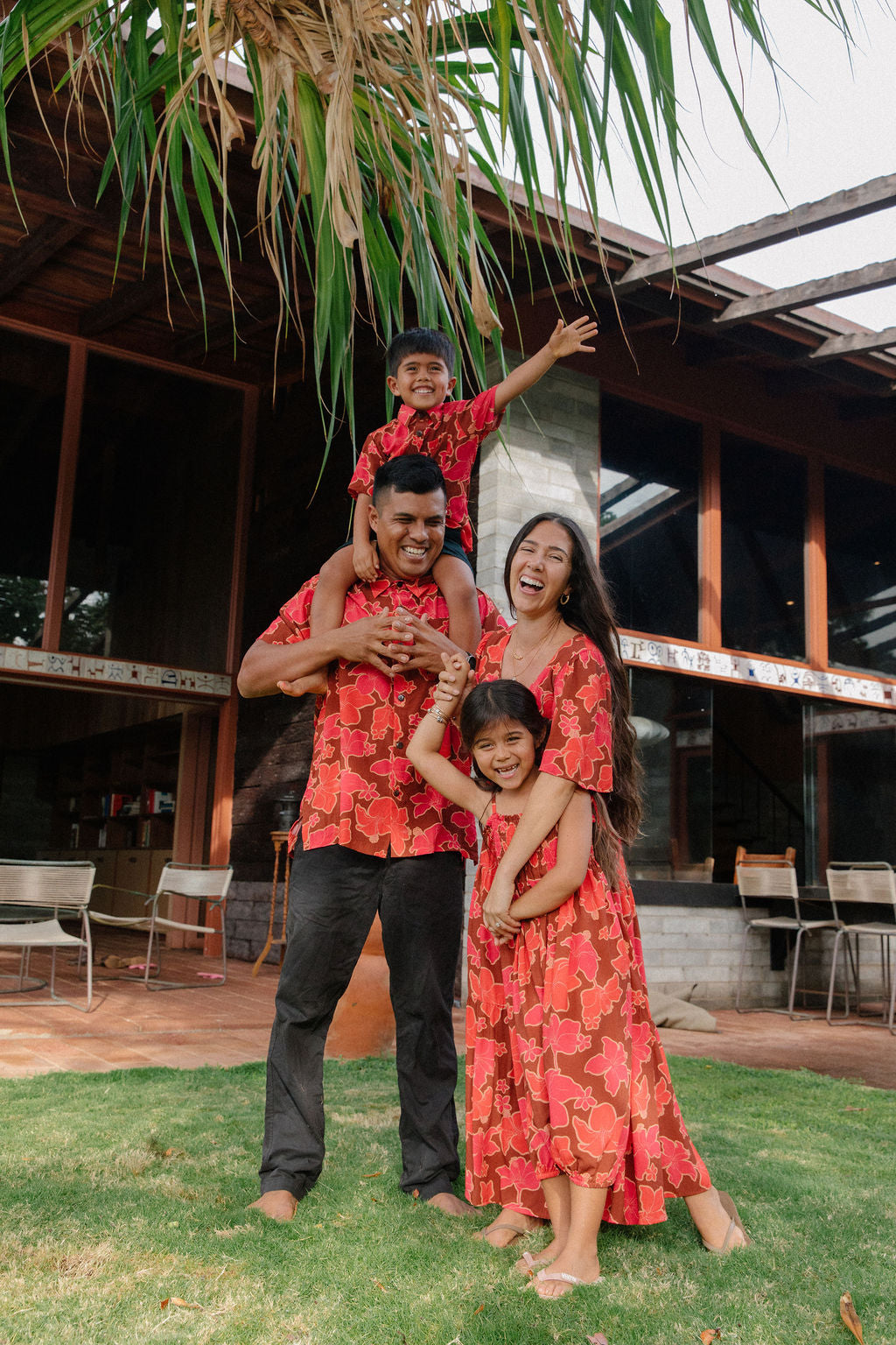 man wearing aloha shirt with vibrant pink pua pattern