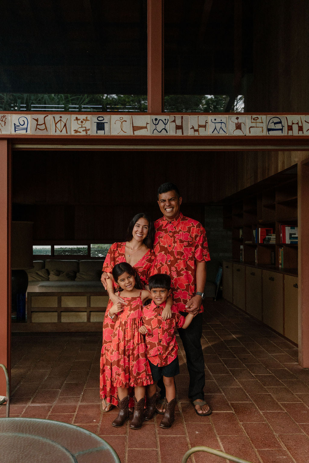 man wearing aloha shirt with vibrant pink pua pattern