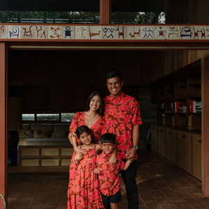man wearing aloha shirt with vibrant pink pua pattern