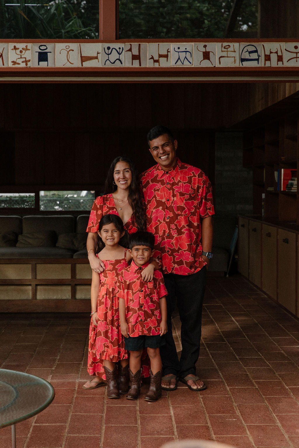 man wearing aloha shirt with vibrant pink pua pattern