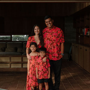 man wearing aloha shirt with vibrant pink pua pattern