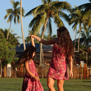 little girl wearing a shell and pua print in pink