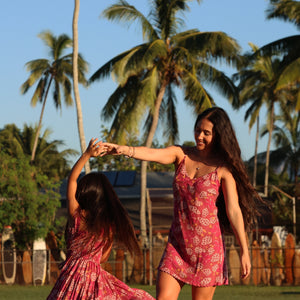 little girl wearing a shell and pua print in pink