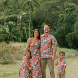 little boy wearing an aloha button up shirt with red ginger and tiare print