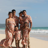 little boy wearing jade colored aloha button up with tiare ginger print