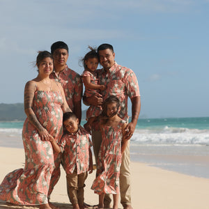 little boy wearing jade colored aloha button up with tiare ginger print