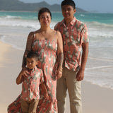 little boy wearing jade colored aloha button up with tiare ginger print