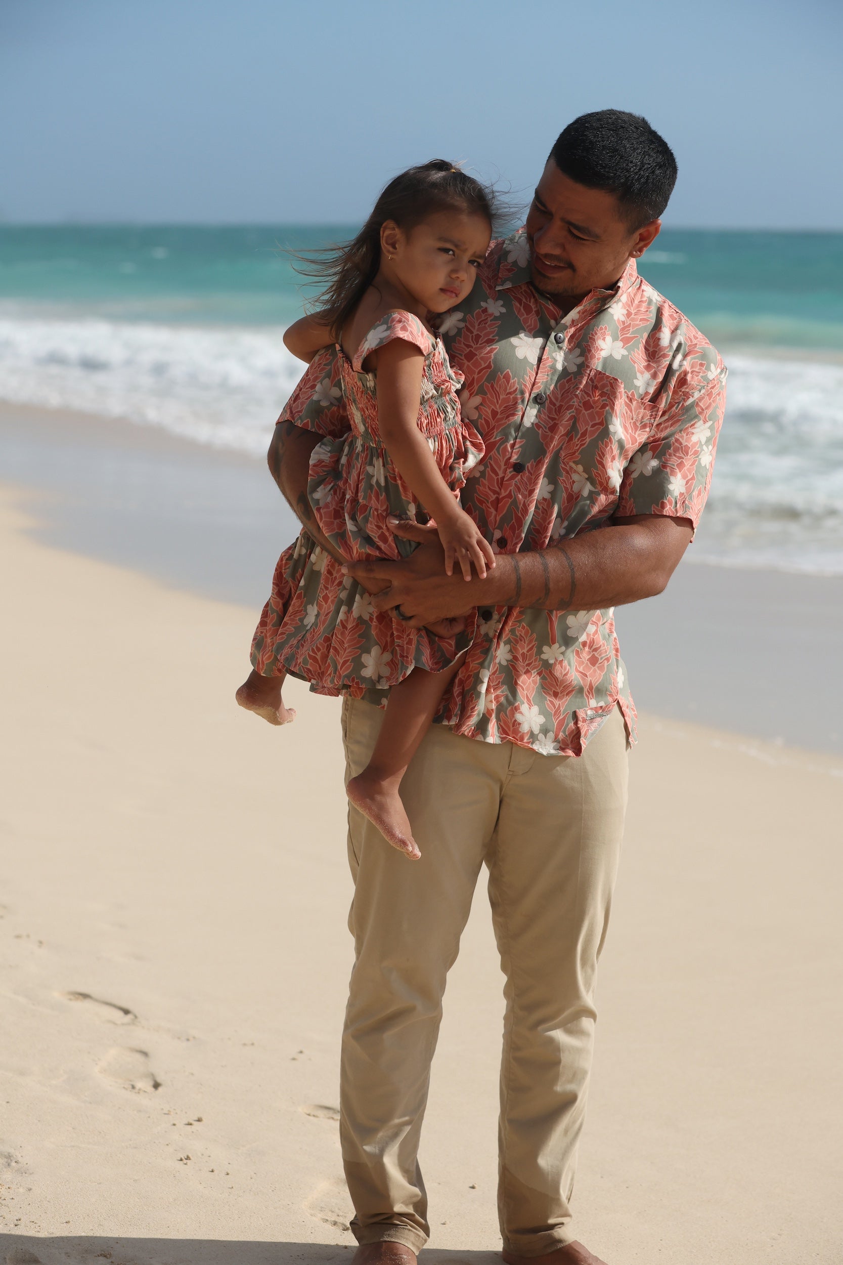 man wearing jade aloha button up with tiare ginger print
