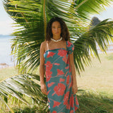 woman wearing rich teal pareo with red hau flower print