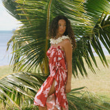 woman with brown hair wearing red pareo with light pink ginger + lei print
