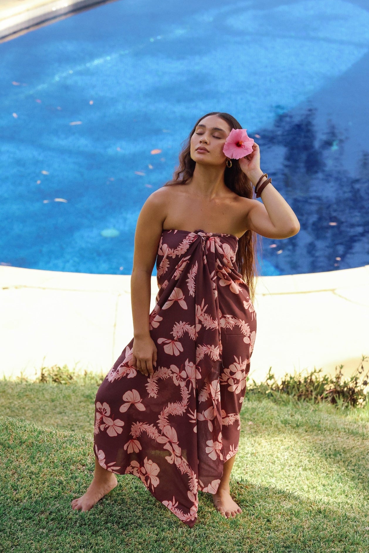 woman wearing pareo with awapuhi print