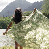 woman wearing a green pareo with native Hawaii plants 