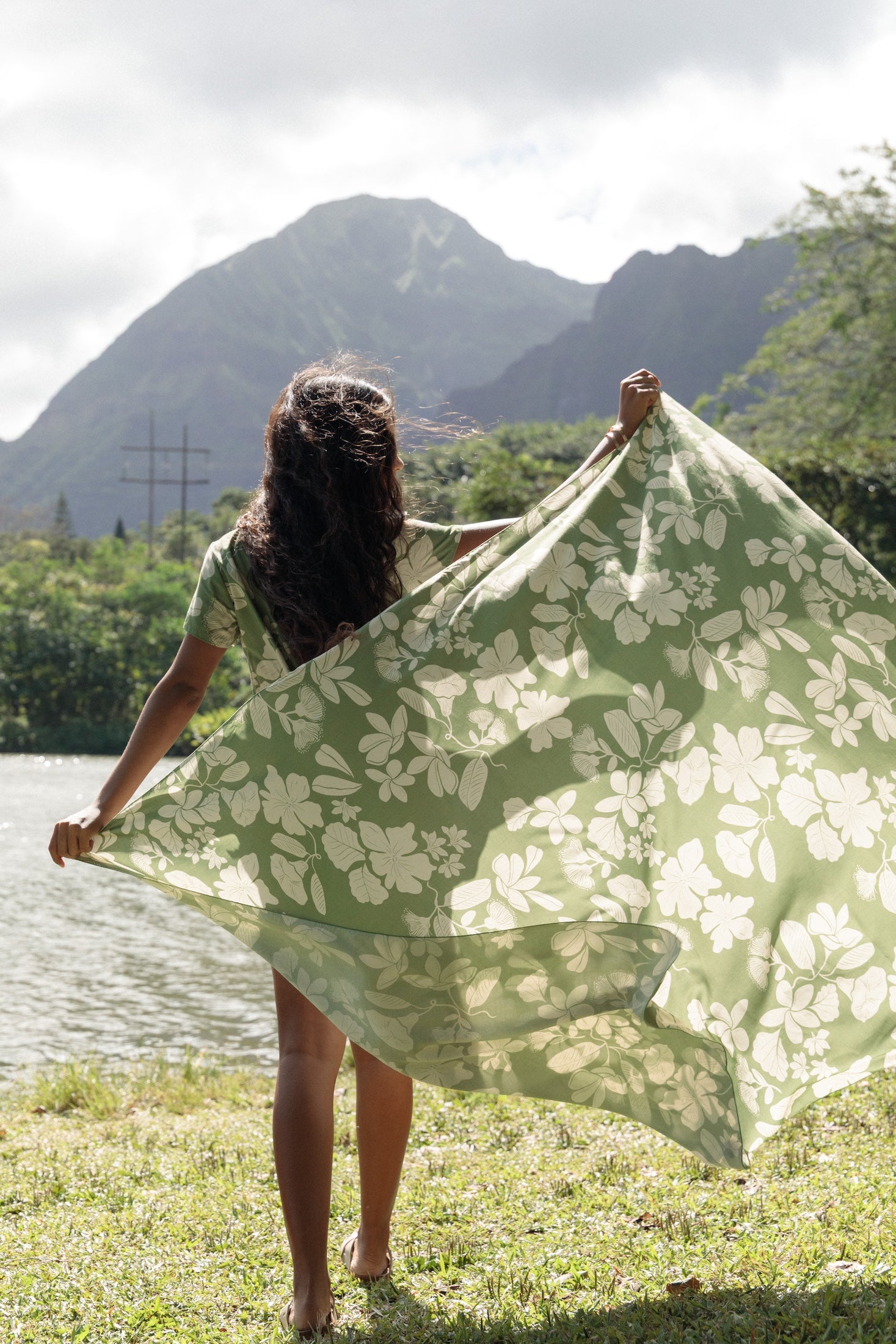 woman wearing a green pareo with native Hawaii plants 
