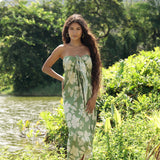 woman wearing a green pareo with native Hawaii plants 