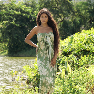 woman wearing a green pareo with native Hawaii plants 