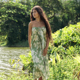 woman wearing a green pareo with native Hawaii plants 