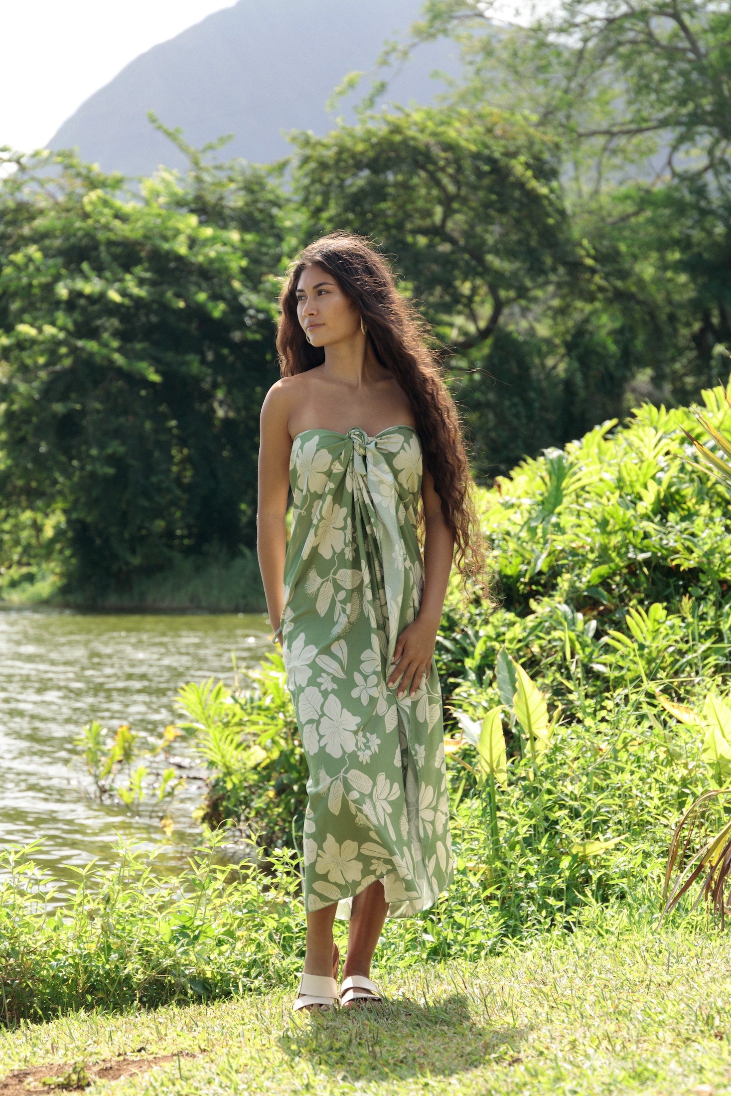 woman wearing a green pareo with native Hawaii plants 