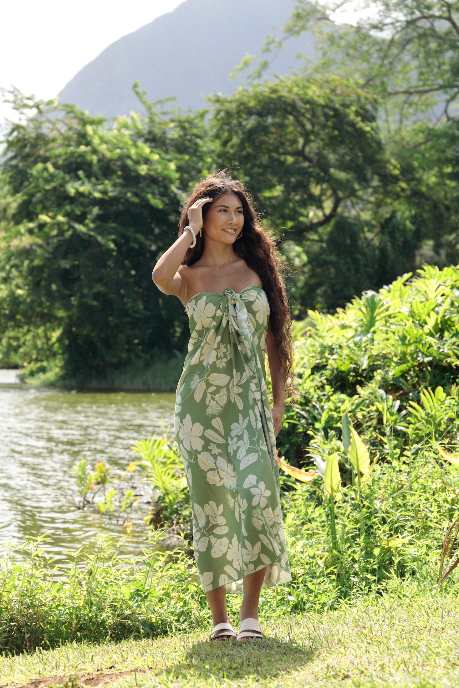 woman wearing a green pareo with native Hawaii plants 