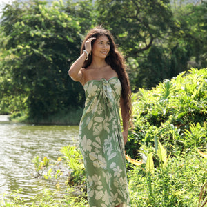 woman wearing a green pareo with native Hawaii plants 