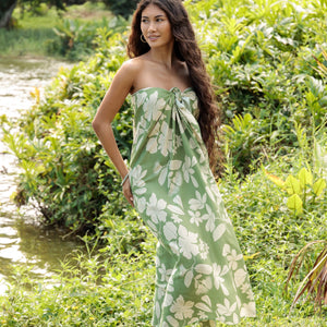 woman wearing a green pareo with native Hawaii plants 