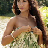 woman wearing a green pareo with native Hawaii plants 