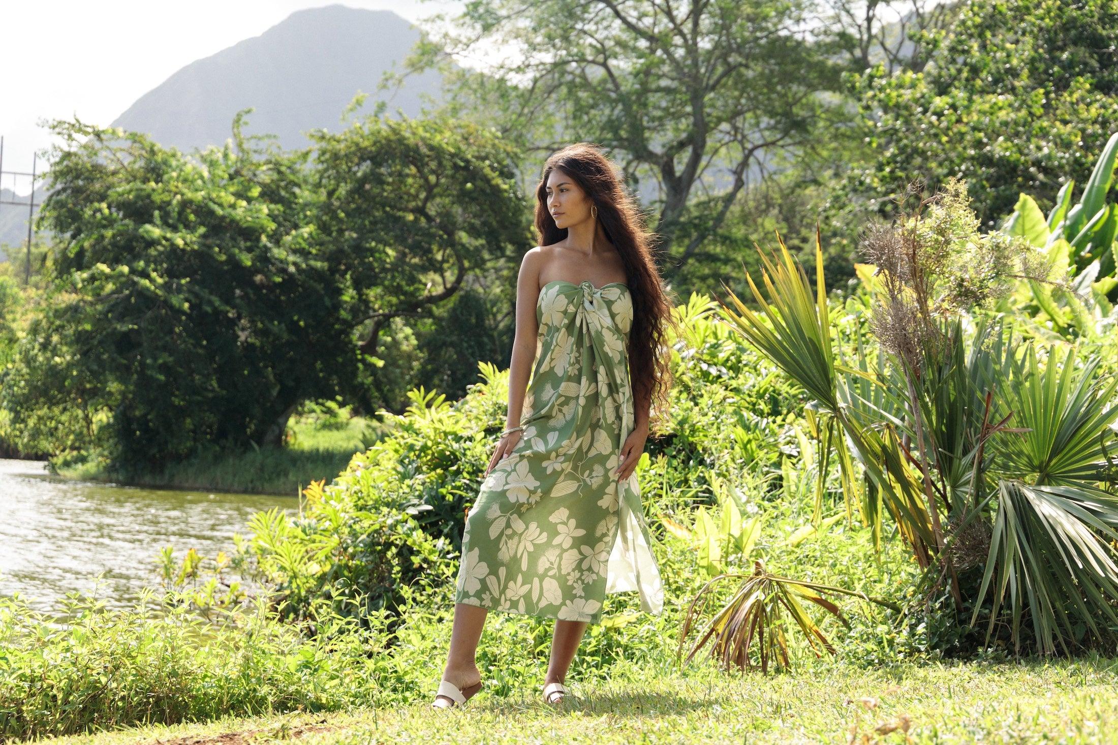 woman wearing a green pareo with native Hawaii plants 