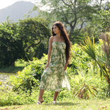 woman wearing a green pareo with native Hawaii plants 