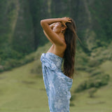 woman wearing blue paisley print pareo