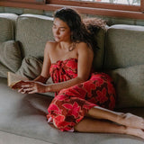 woman wearing retro pareo with vibrant pink pua pattern