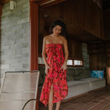 woman wearing retro pareo with vibrant pink pua pattern