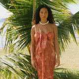 woman with brown hair wearing terra colored pareo