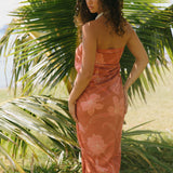 woman with brown hair wearing terra colored pareo
