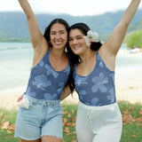 woman wearing a bodysuit with blue hibiscus pattern