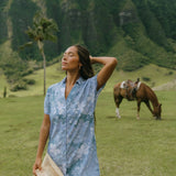 woman with brown hair wearing blue paniolo print collared button down dress