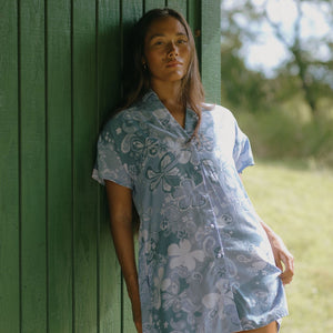 woman with brown hair wearing blue paniolo print collared button down dress