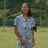 woman with brown hair wearing blue paniolo print collared button down dress
