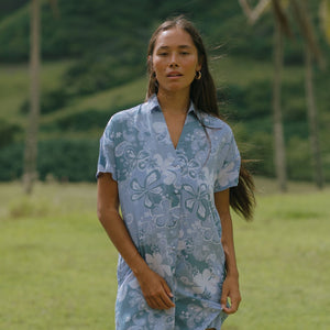 woman with brown hair wearing blue paniolo print collared button down dress