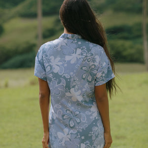 woman with brown hair wearing blue paniolo print collared button down dress