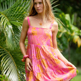 woman wearing a pink mini dress with lei print