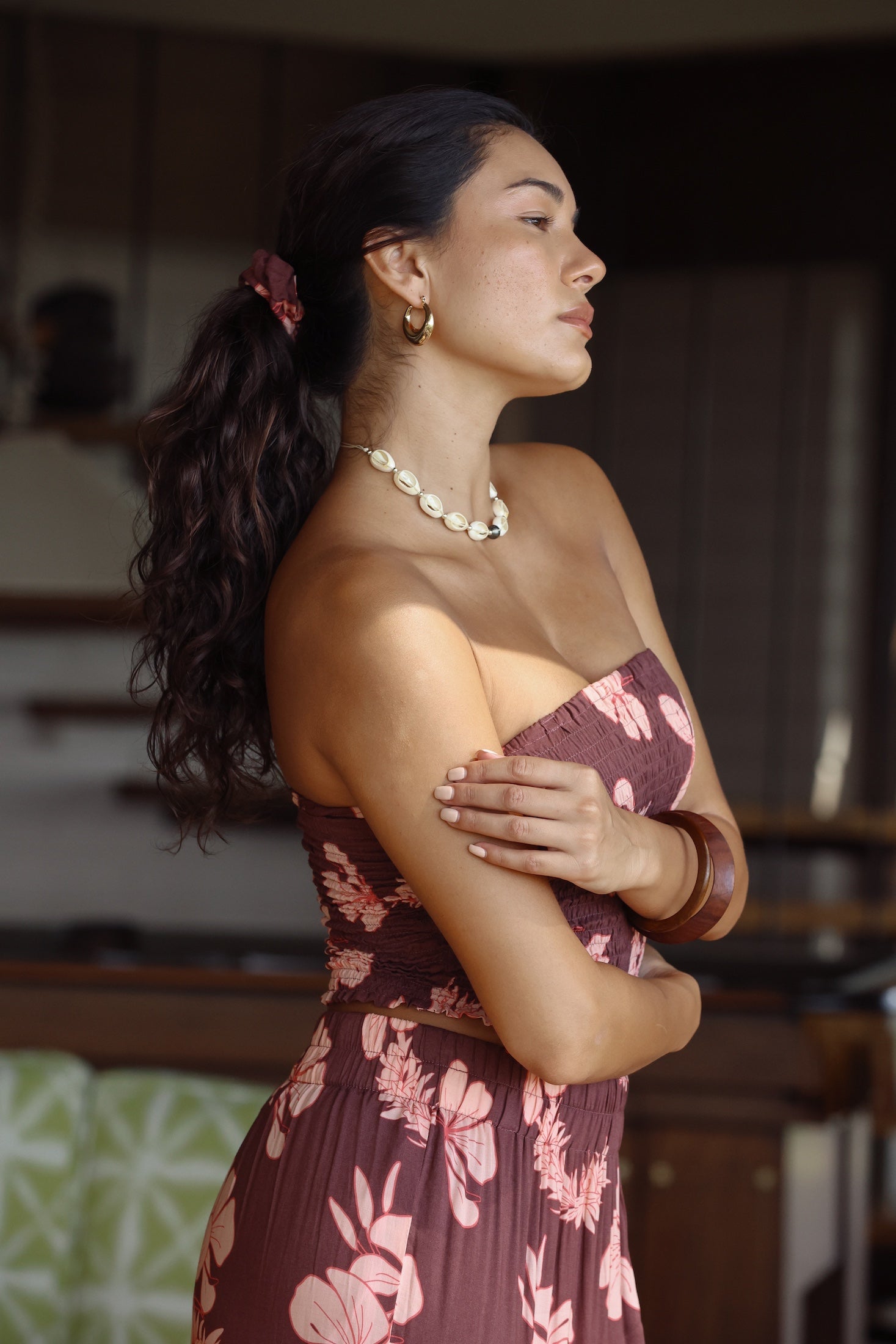 woman wearing mauve scrunchie with lei awapuhi print in hair
