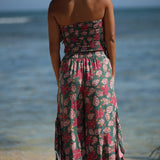 woman with brown hair wearing a teal bandeau top with removable straps with shell and pua print