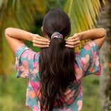 woman wearing scrunchie in floral pattern