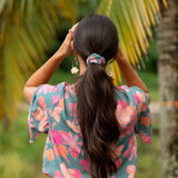 woman wearing scrunchie in floral pattern